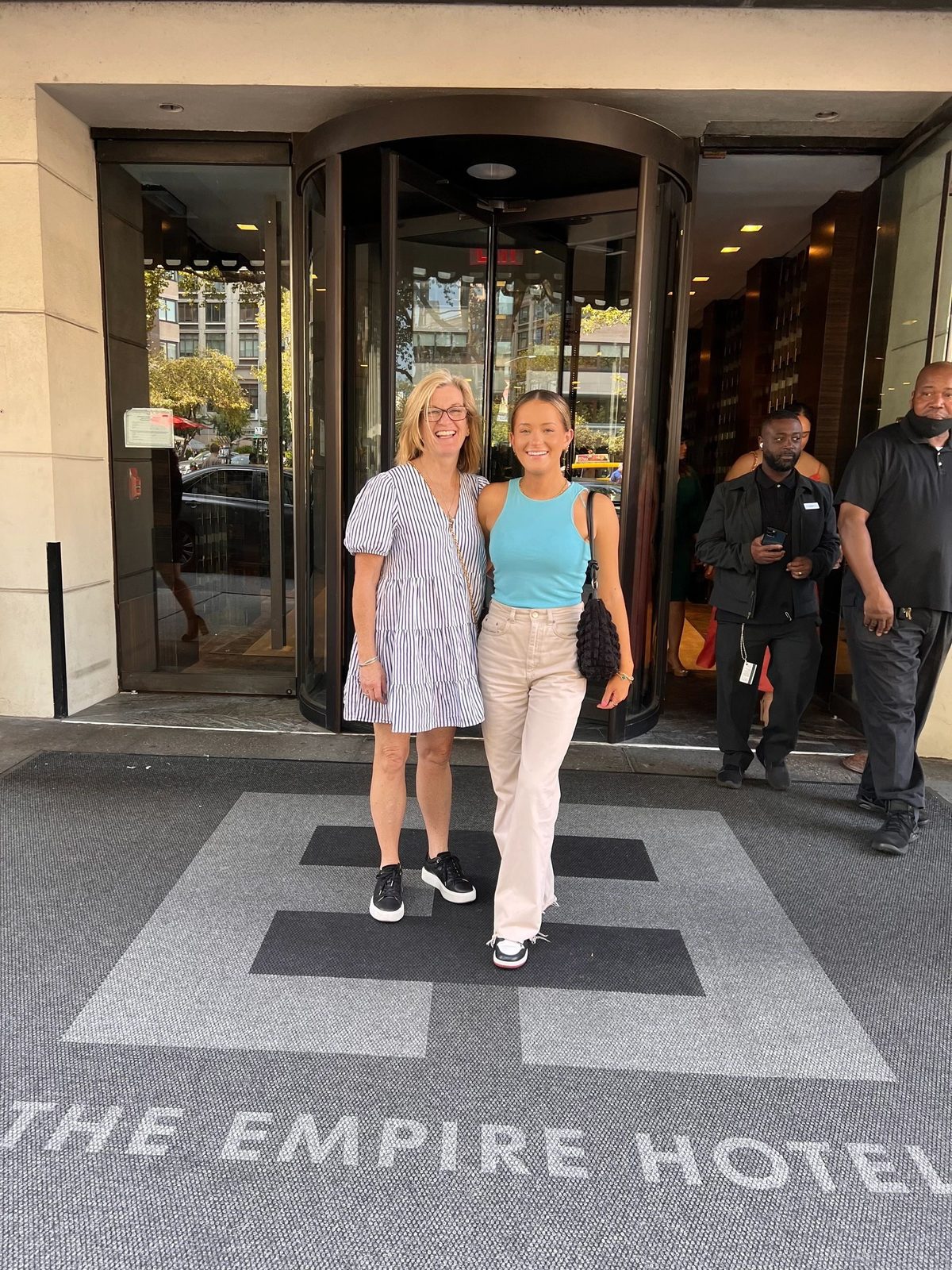 Two guests outside the Empire Hotel entrance during the Friendly Gossip Girl Tour in New York City